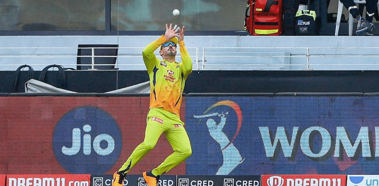  Faf du Plessis of Chennai Superkings takes a catch during the Indian Premier League (IPL) match between the Royal Challengers Bangalore and the Chennai Super Kings, at the Dubai International Cricket Stadium in Dubai, Sunday, Oct. 25, 2020. Credit: PTI Photo