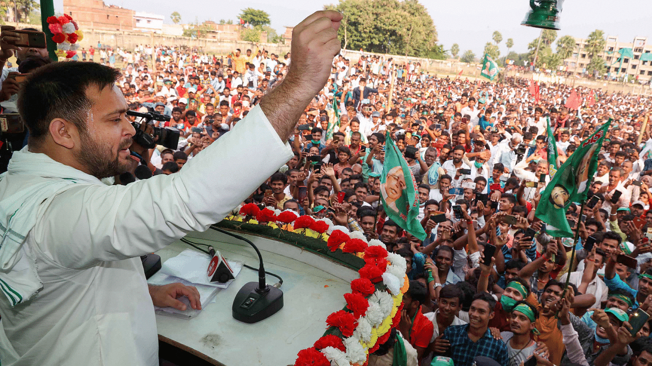 RJD leader Tejashwi Prasad Yadav addresses a gathering during an election rally for the upcoming Bihar assembly elections. Credits: PTI Photo
