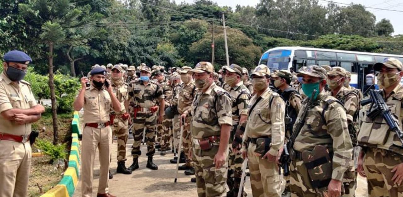 CISF and KSRP personnel and police during the march near Nagarabhavi.