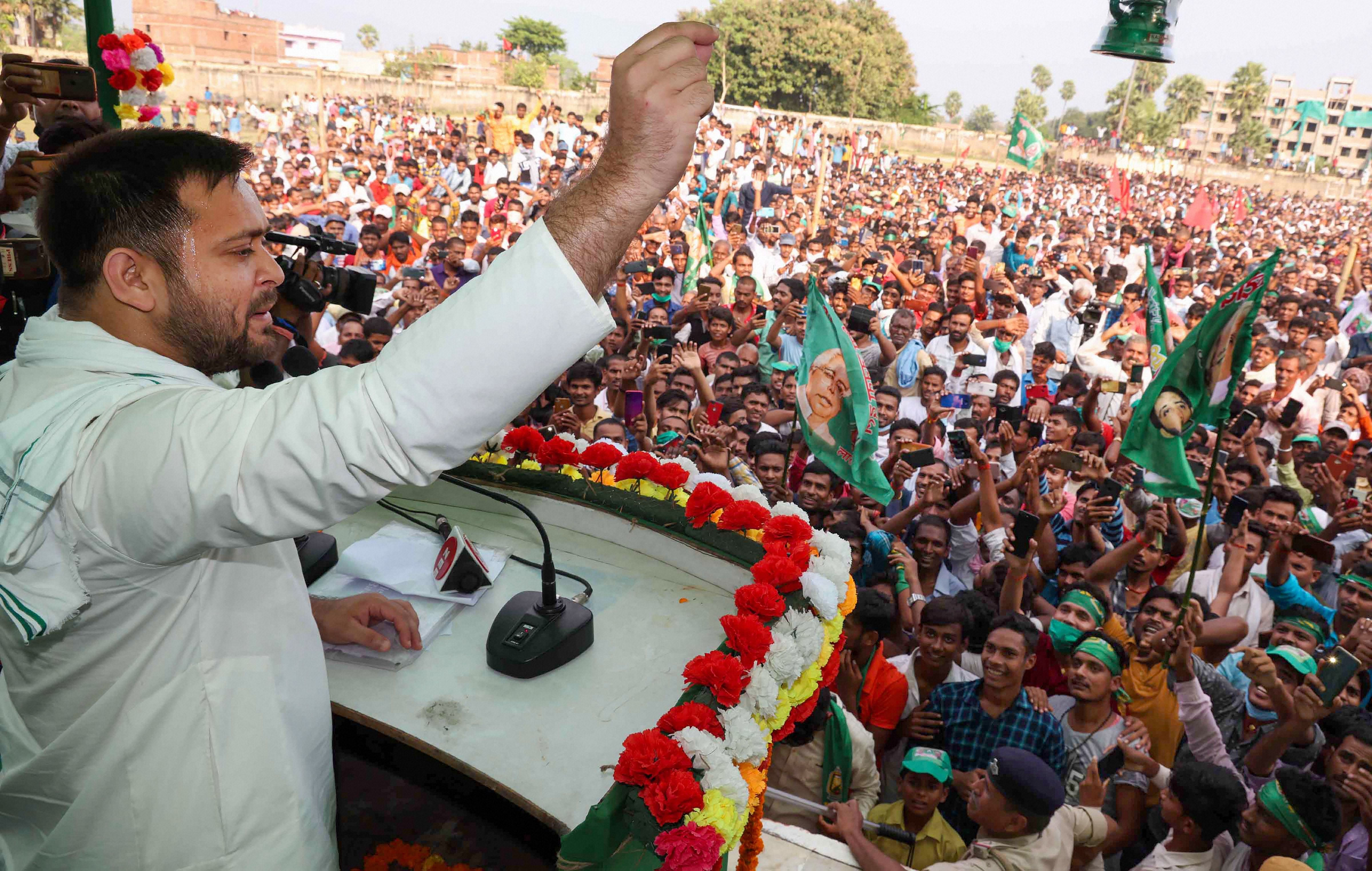 RJD leader Tejashwi Prasad Yadav addresses a gathering during an election rally for the upcoming Bihar assembly elections. Credit: PTI Photo