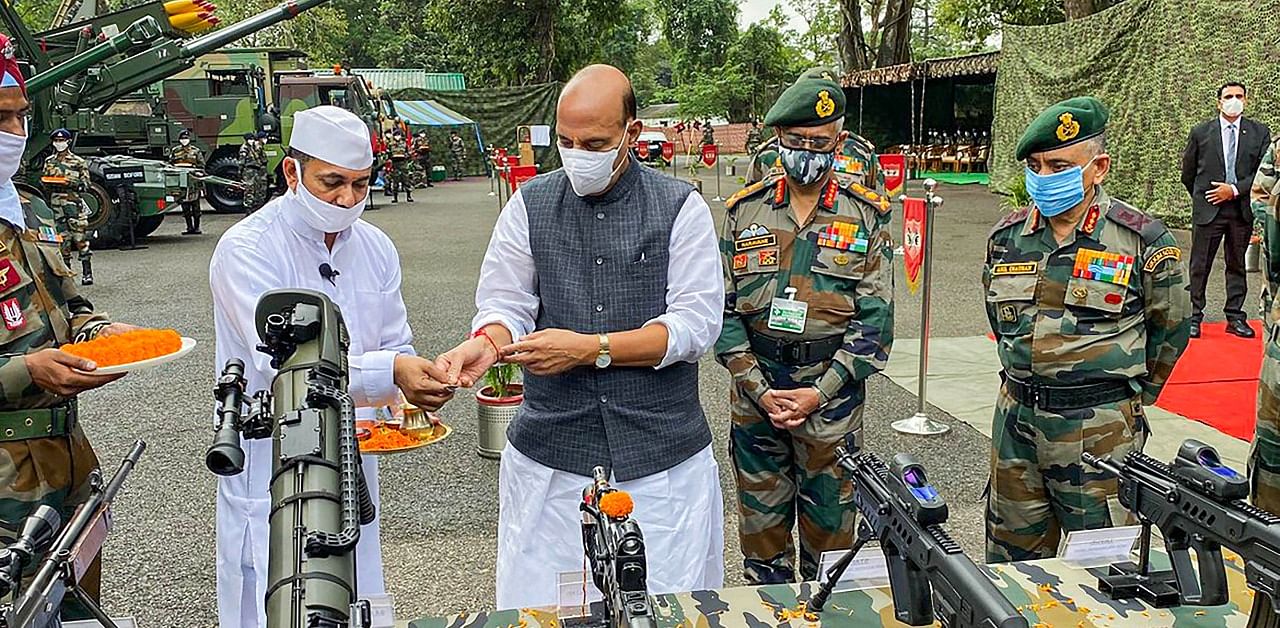 Defence Minister Rajnath Singh performs 'Shastra Puja' on the occasion of Dussehra festival, at the Sukna Army Camp in Darjeeling. Credit: PTI/Twitter