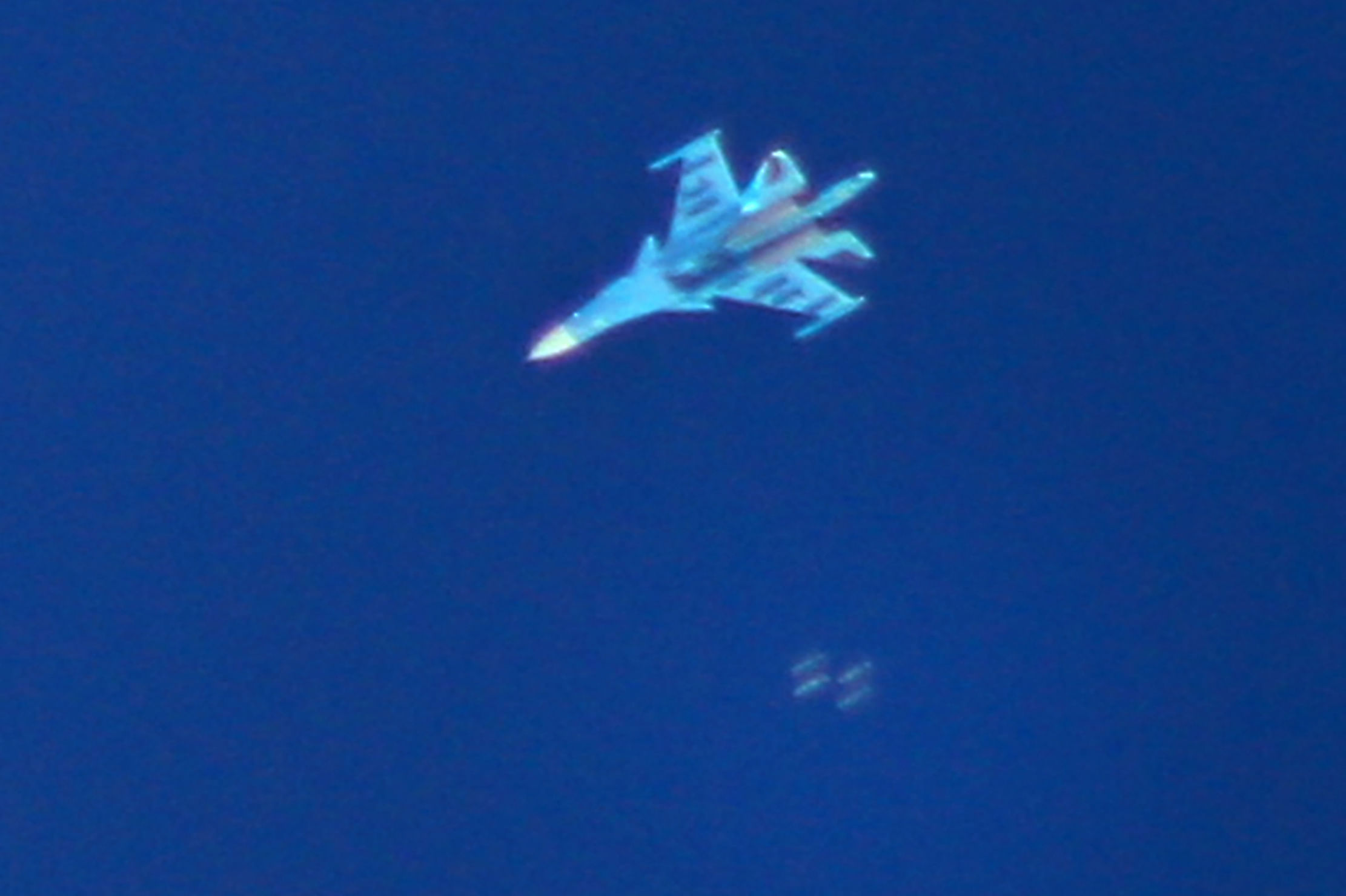 In this file photo taken on September 7, 2018, Russian Sukhoi Su-34 fighter drops bombs over the Syrian village of Kafr Ain in the southern countryside of Idlib province. - Air strikes by Syrian regime ally Russia killed 56 fighters from a Turkey-backed rebel group in northwest Syria on October 26, 2020, a Britain-based war monitor said. Russian warplanes also wounded 100 people when they targeted a training camp of the Faylaq al-Sham faction in the Jabal Duwayli area in Idlib province, the Syrian Observatory for Human Rights said. Credit: AFP