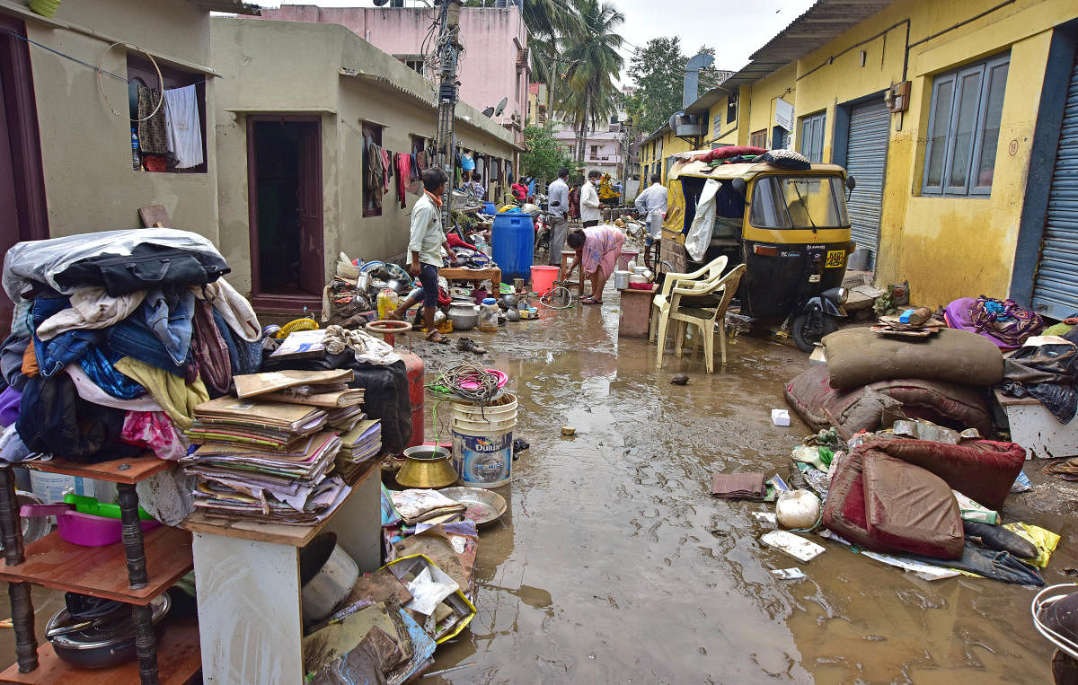 Heavy rain, which lashed the city on Friday, has disrupted life in Dattatreya Nagar, Hosakerehalli. The rain tore down a portion of a stormwater drain wall. Credit: DH File Photo/Irshad Mahammad