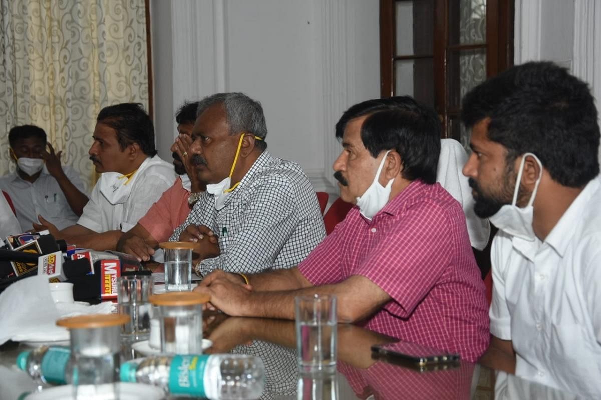 Cooperation Minister S T Somashekar, during a media conference in Mysuru on Tuesday. MUDA Chairman H V Rajeev, MLAs L Nagendra and S A Ramadass and MP Pratap Simha are seen. DH PHOTO