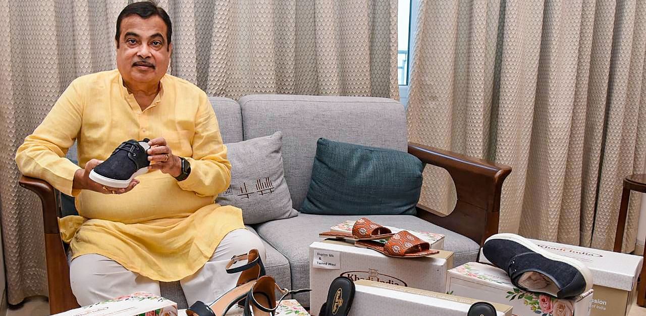 Union Minister for MSME Nitin Gadkari takes a look at high quality Khadi fabric footwear. Credit: PTI