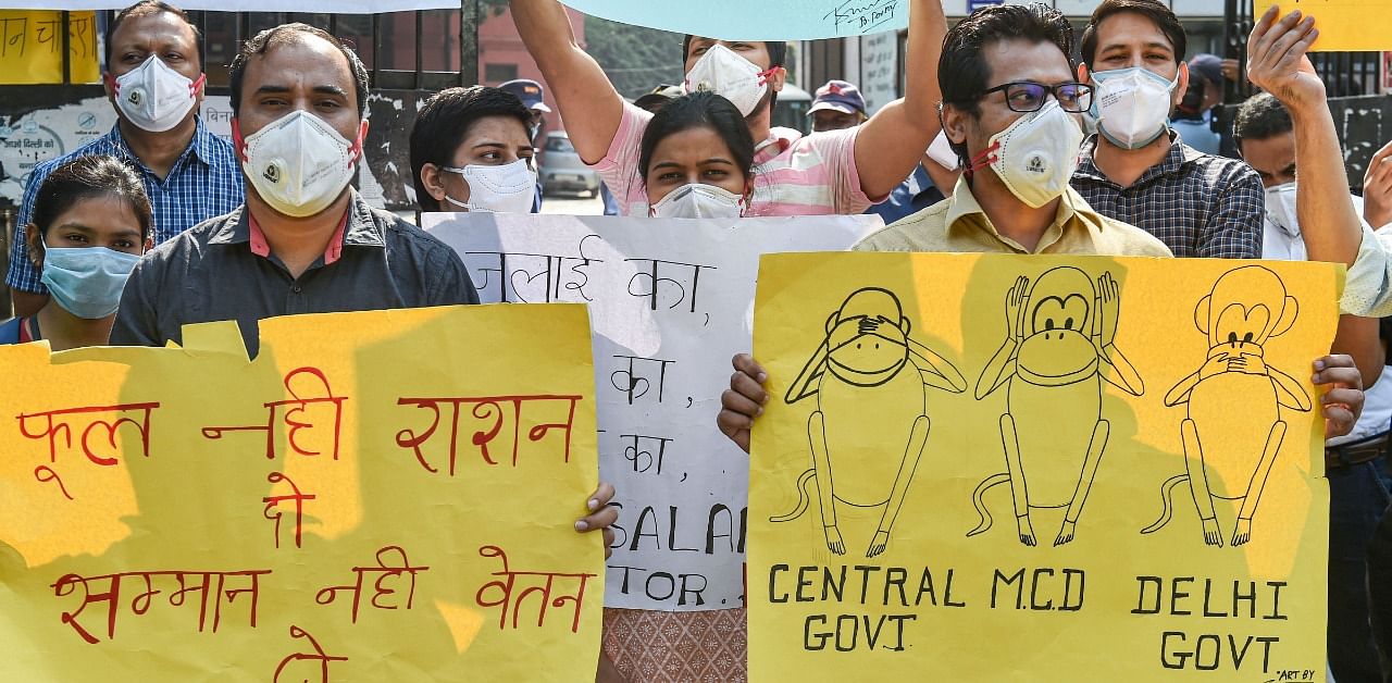 Resident doctors of Kasturba Hospital demonstrate over non-payment of their pending salaries by North Delhi Municipal Corporation, in New Delhi. Credit: PTI