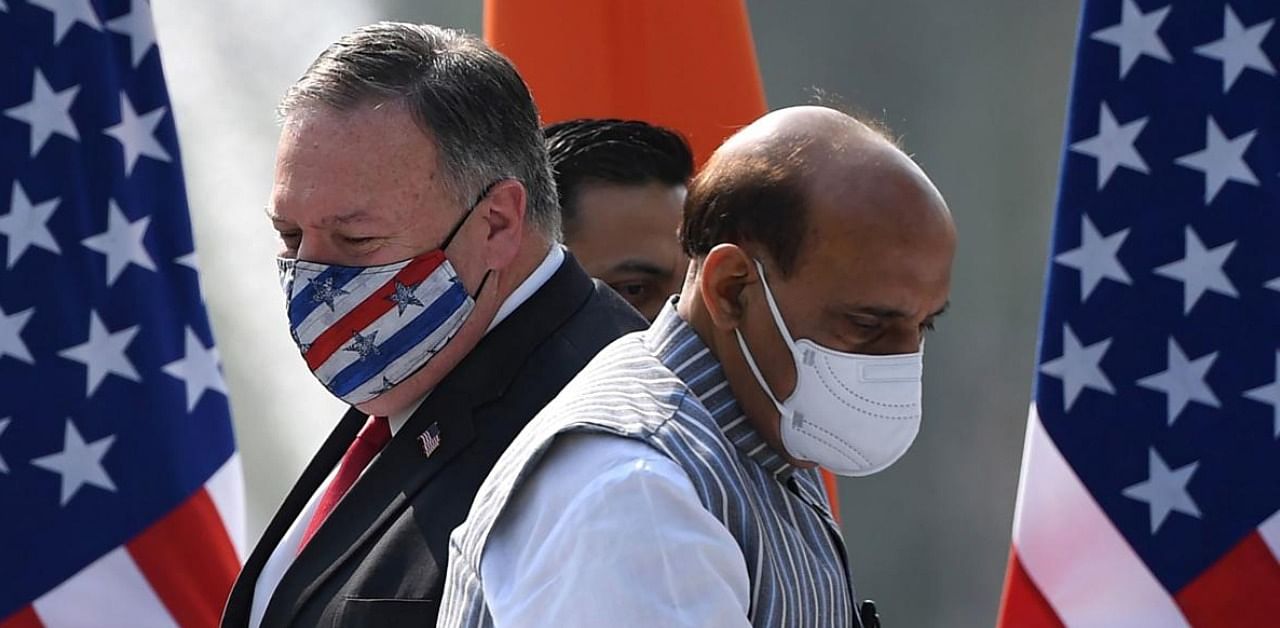 US Secretary of State Mike Pompeo (L) and India's Defence Minister Rajnath Singh arrive to address a joint press briefing in the lawns of Hyderabad House in New Delhi on October 27, 2020. (Photo by Money SHARMA / AFP)