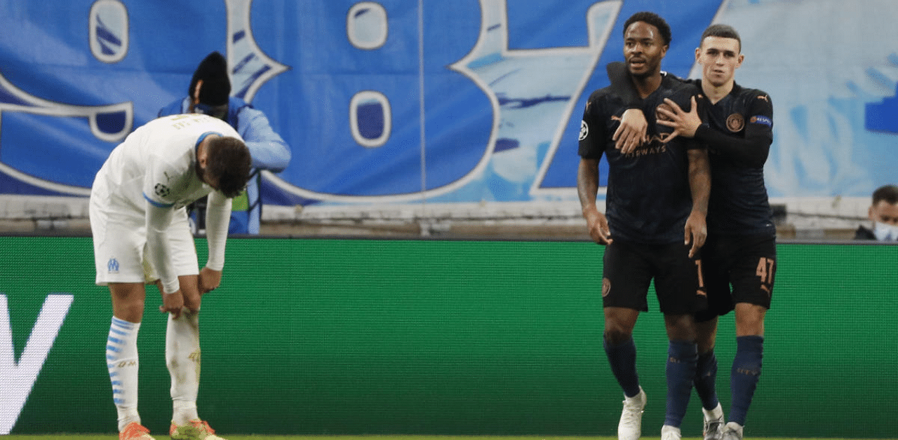 Manchester City's Raheem Sterling celebrates scoring their third goal with Phil Foden. Credit: Reuters Photo