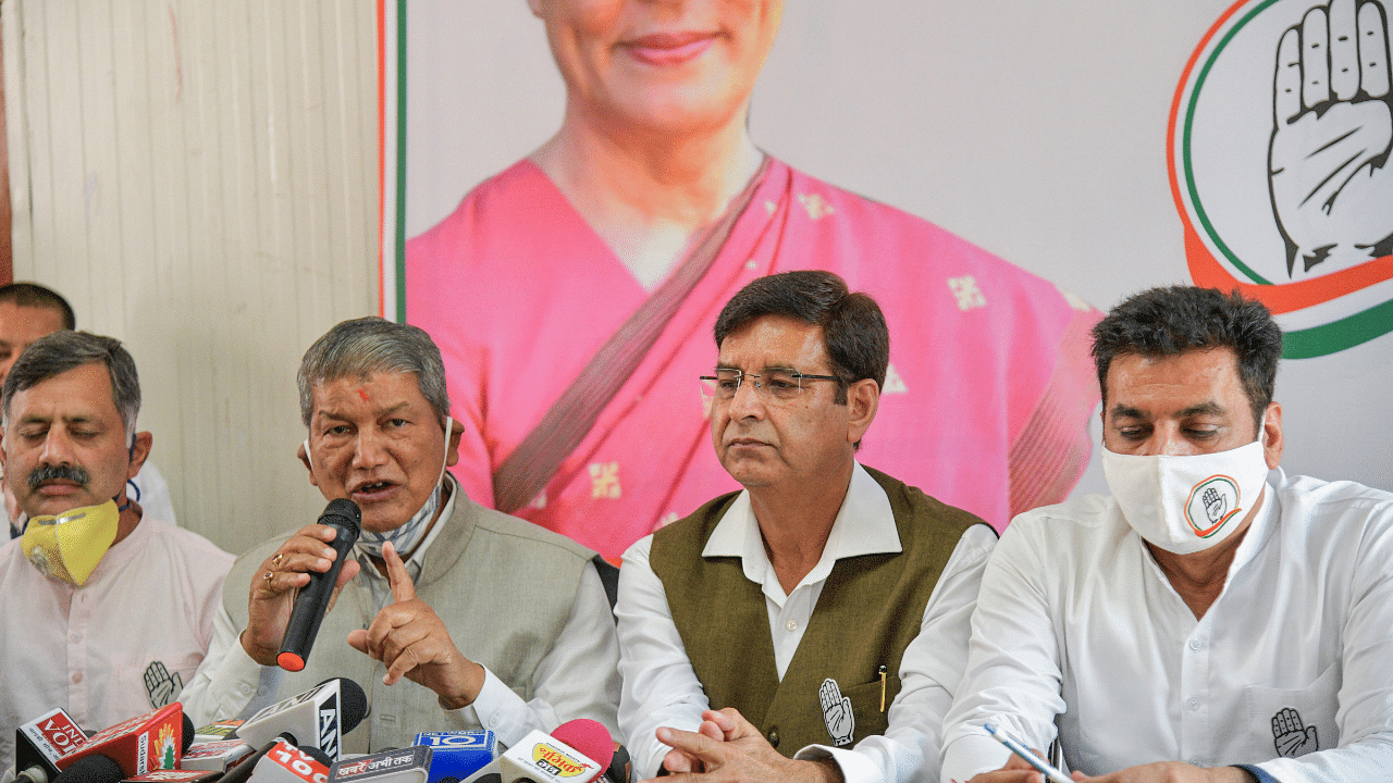 Congress General Secretary Harish Rawat with party Uttarakhand in-charge Devender Yadav and others addresses journalists after the HC ordered CBI probe on charges against CM Trivendra Singh Rawat. Credits: PTI Photo
