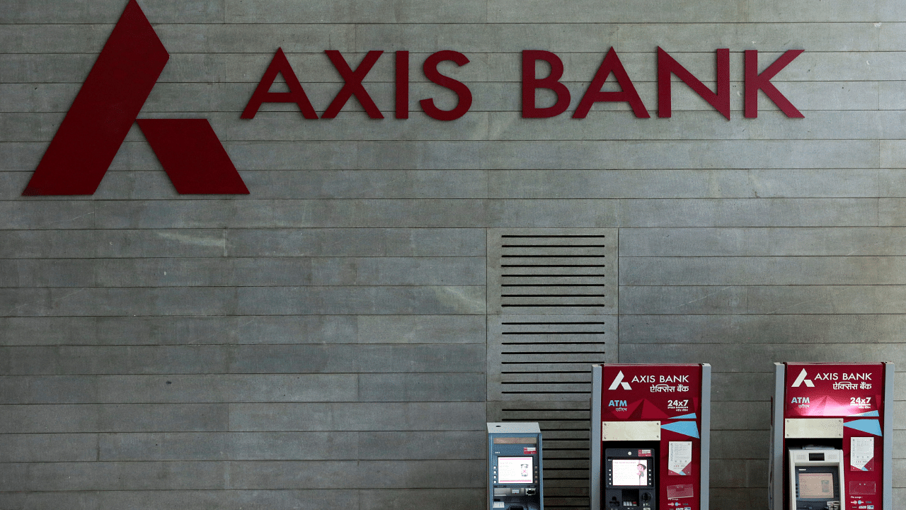 Axis Bank's logo is seen next to ATM machines at its corporate headquarters in Mumbai. Credits: Reuters Photo