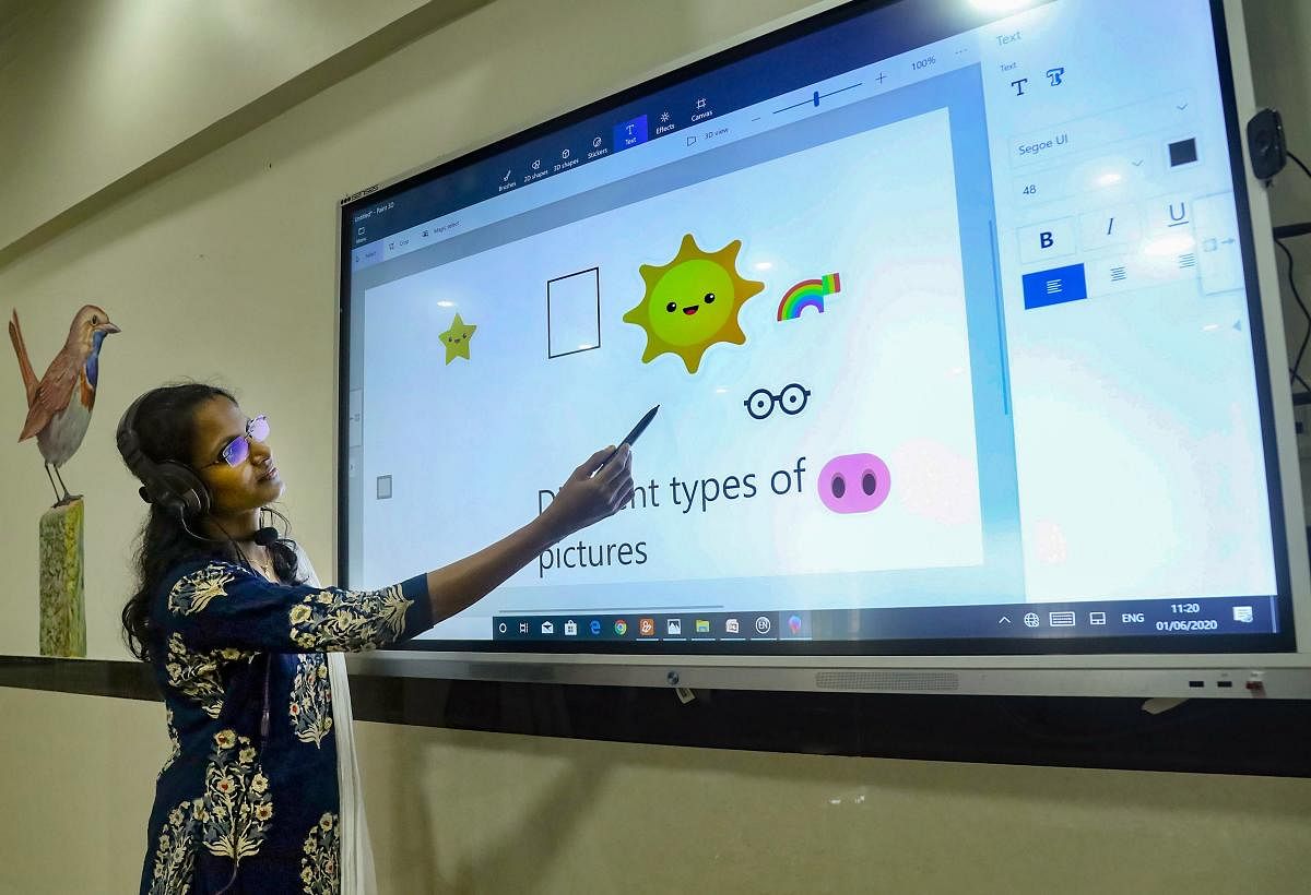 A teacher takes an online class for school students. PTI Photo