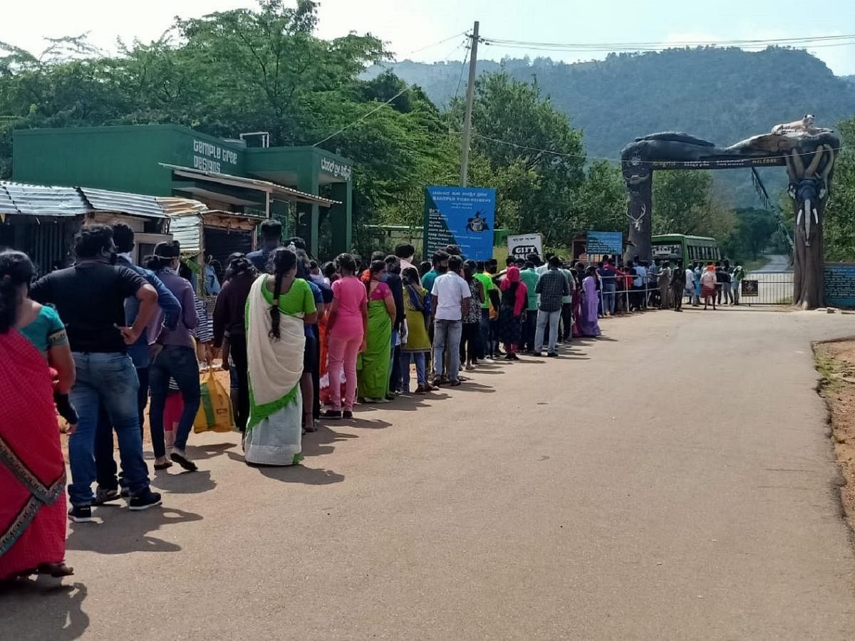 A large number of devotees wait for the bus to reach Himavad Gopalaswamy Temple, atop the hill, under Bandipur National Park in Chamarajanagar district on Wednesday. DH PHOTO