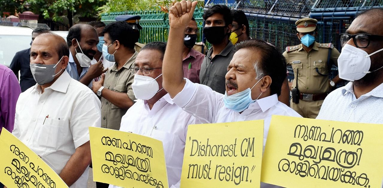 Leader of the Opposition Ramesh Chennithala shout slogans during a protest march before the state secretariat demanding the resignation of Kerala Chief Minister Pinarayi Vijayan, in Thiruvananthapuram. Credit: PTI