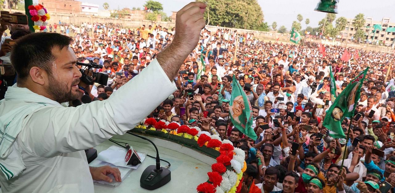 RJD leader Tejashwi Prasad Yadav addresses a gathering during an election rally for the upcoming Bihar assembly elections, in Munger district. Credit: PTI Photo