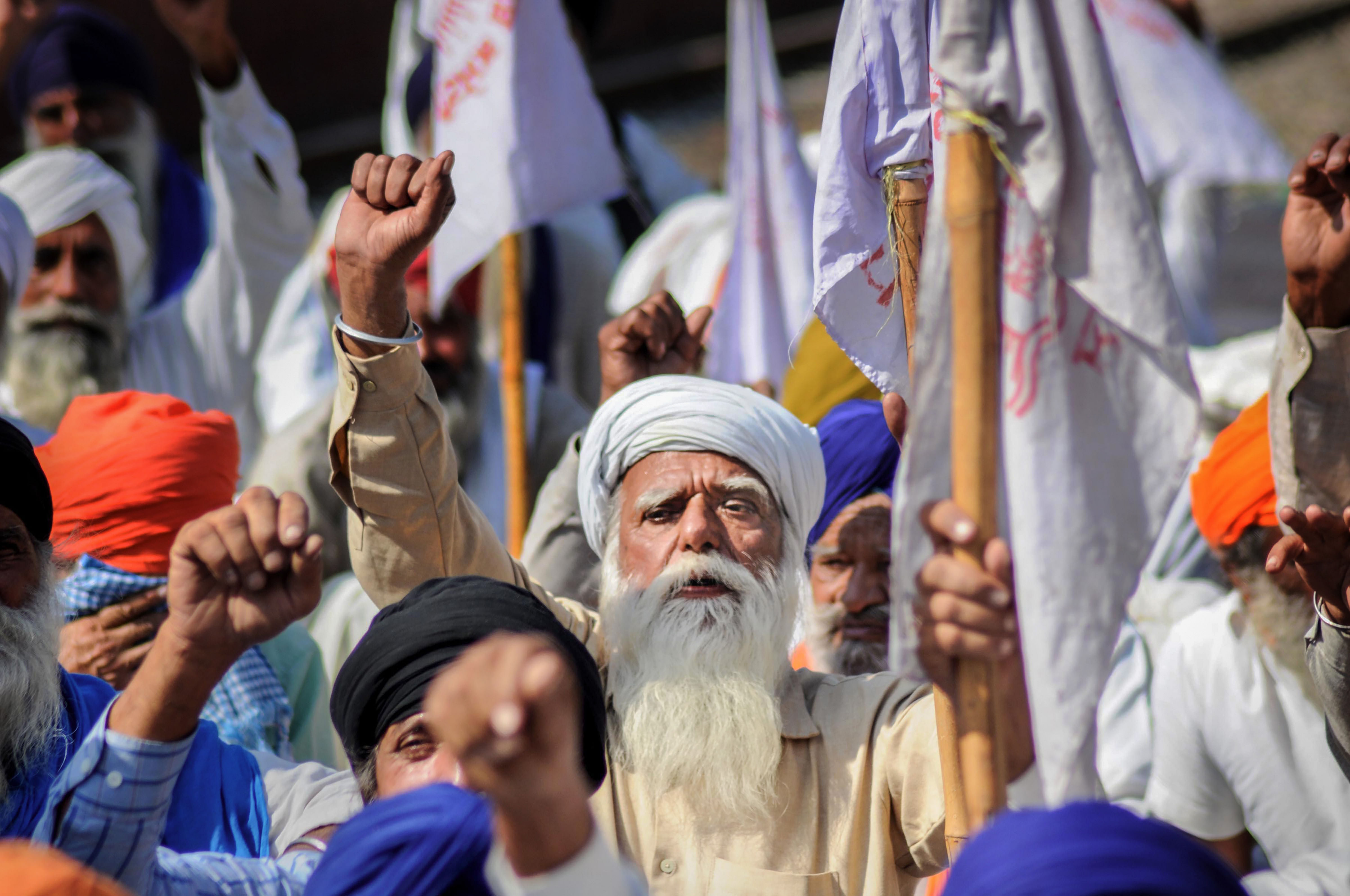 Farmers block railway tracks during a protest against the new farm bills, at Jandiala Guru in Amritsar, Tuesday, Oct. 27, 2020. Credit: PTI Photo