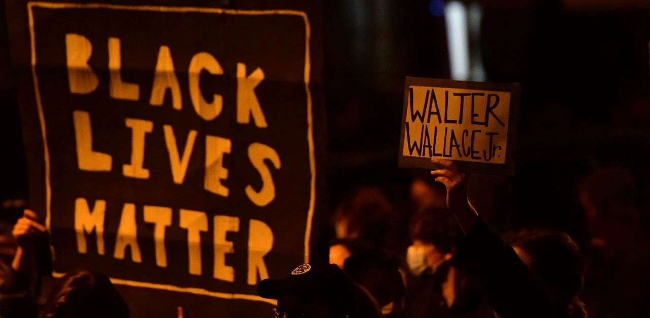 Demonstrators gather in protest near the location where Walter Wallace, Jr. was killed by two police officers on October 27, 2020 in Philadelphia, Pennsylvania. Credit: AFP Photo