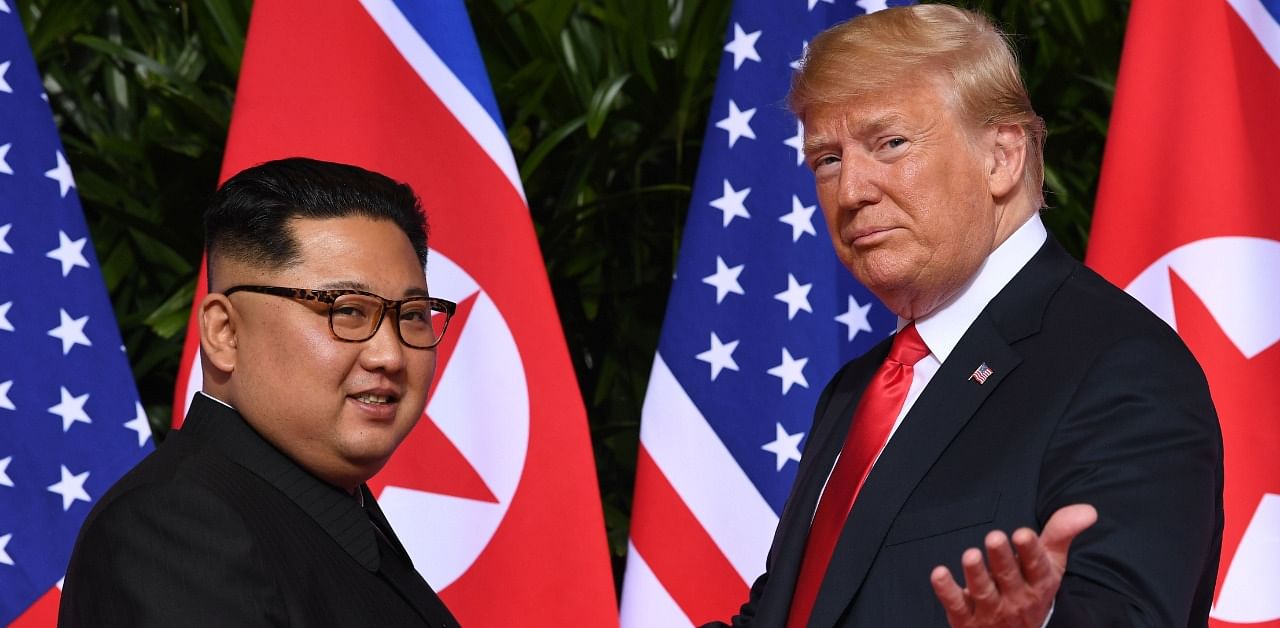 US President Donald Trump (R) meets with North Korea's leader Kim Jong Un (L). Credit: AFP Photo