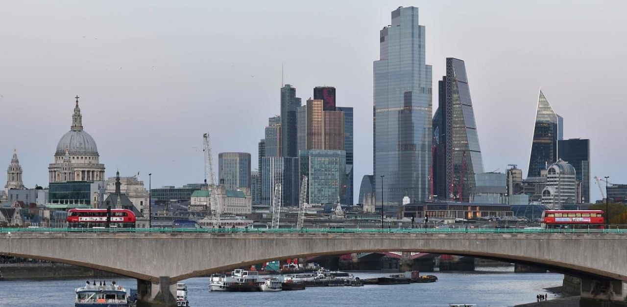 A picture shows Waterloo Bridge over the River Thames in London on October 25, 2020 with the City of London financial district in the background. Credit: AFP.