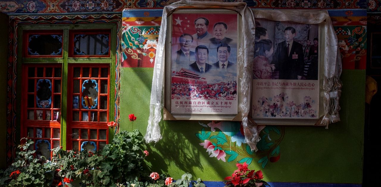 Pictures of Chinese President Xin Jinping and former Chinese leaders Jiang Zemin, Mao Zedong, Deng Xiaoping and Hu Jintao are seen in the house of Tibetan farmer Dzekyid in Jangdam village in Samzhubze District outside Shigatse, during a government-organised tour of the Tibet Autonomous Region, China. Credit: Reuters Photo