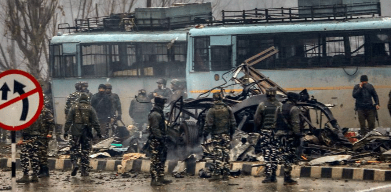 Security personnel carry out the rescue and relief works at the site of suicide bomb attack at Lathepora Awantipora in Pulwama district of south Kashmir, Thursday, February 14, 2019. Credit: PTI Photo