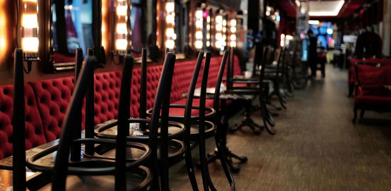 Chairs have been put on the tables at Cafe Utopia three days before German restaurants and bars go under lockdown again as the spread of Covid-19 continues in Frankfurt, Germany. Credit: Reuters.