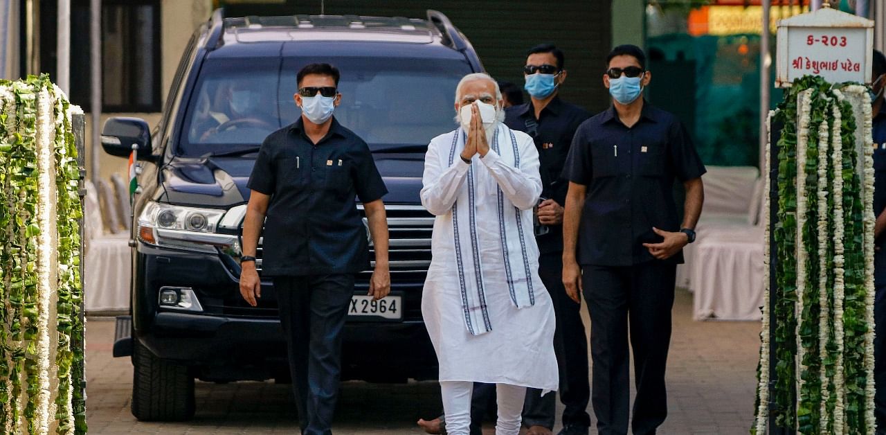 Prime minister Narendra Modi leaves the residence of former Gujarat chief minister late Keshubhai Patel after paying condolence to Patel's family, in Gandhinagar. Credit: PTI Photo