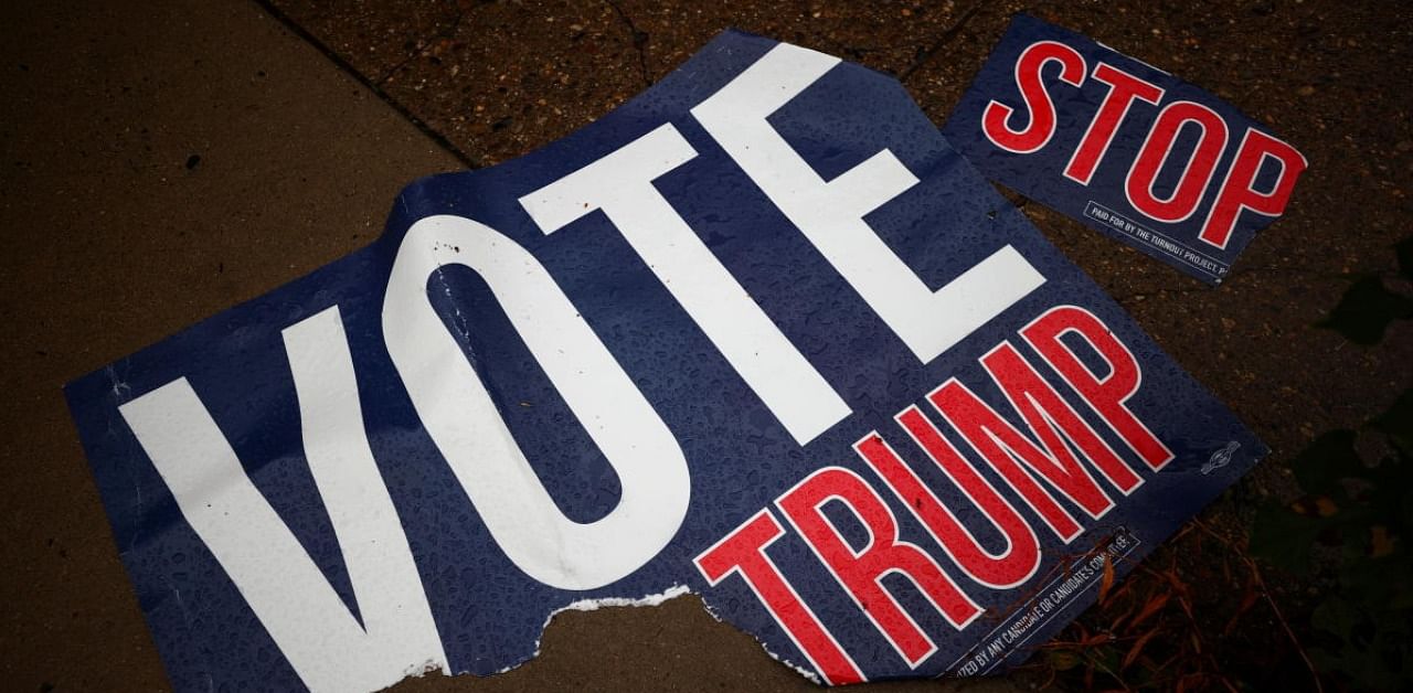 A torn voting sign lies on the pavement, in Philadelphia. Credit: Reuters.
