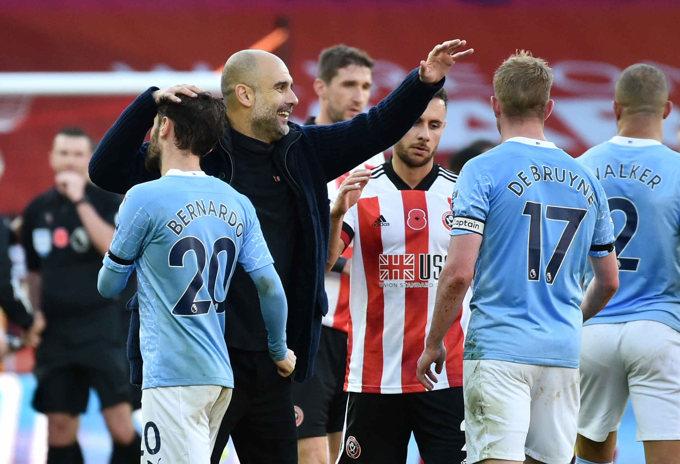 Manchester City manager Pep Guardiola celebrates with Bernardo Silva and Kevin De Bruyne after the match. Credits: Reuters Photo