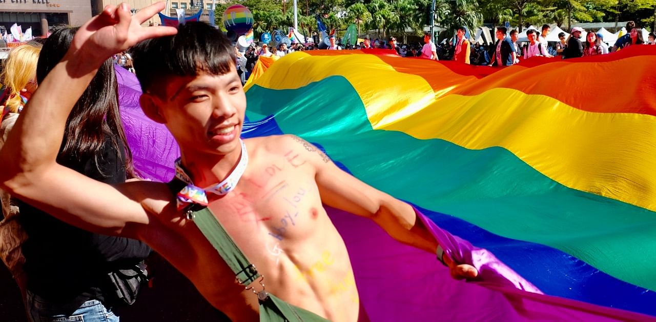 A LGBT rights activist poses for photographs during the annual Gay Pride Parade in Taipei on October 31, 2020. Credit: AFP Photo