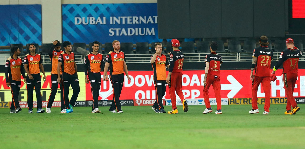 SRH and RCB players bump fists after the previous fixture. Credit: iplt20.com, BCCI