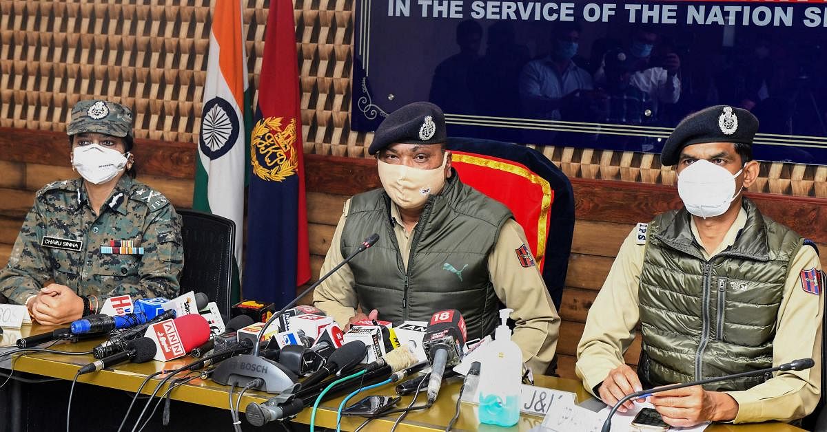 Director General of Jammu and Kashmir police Dilbagh Singh (C) flanked by IG CRPF Charu Sinha and IG police Vijay Kumar during a joint press conference regarding Barzulla encounter. Credit: PTI/file photo.