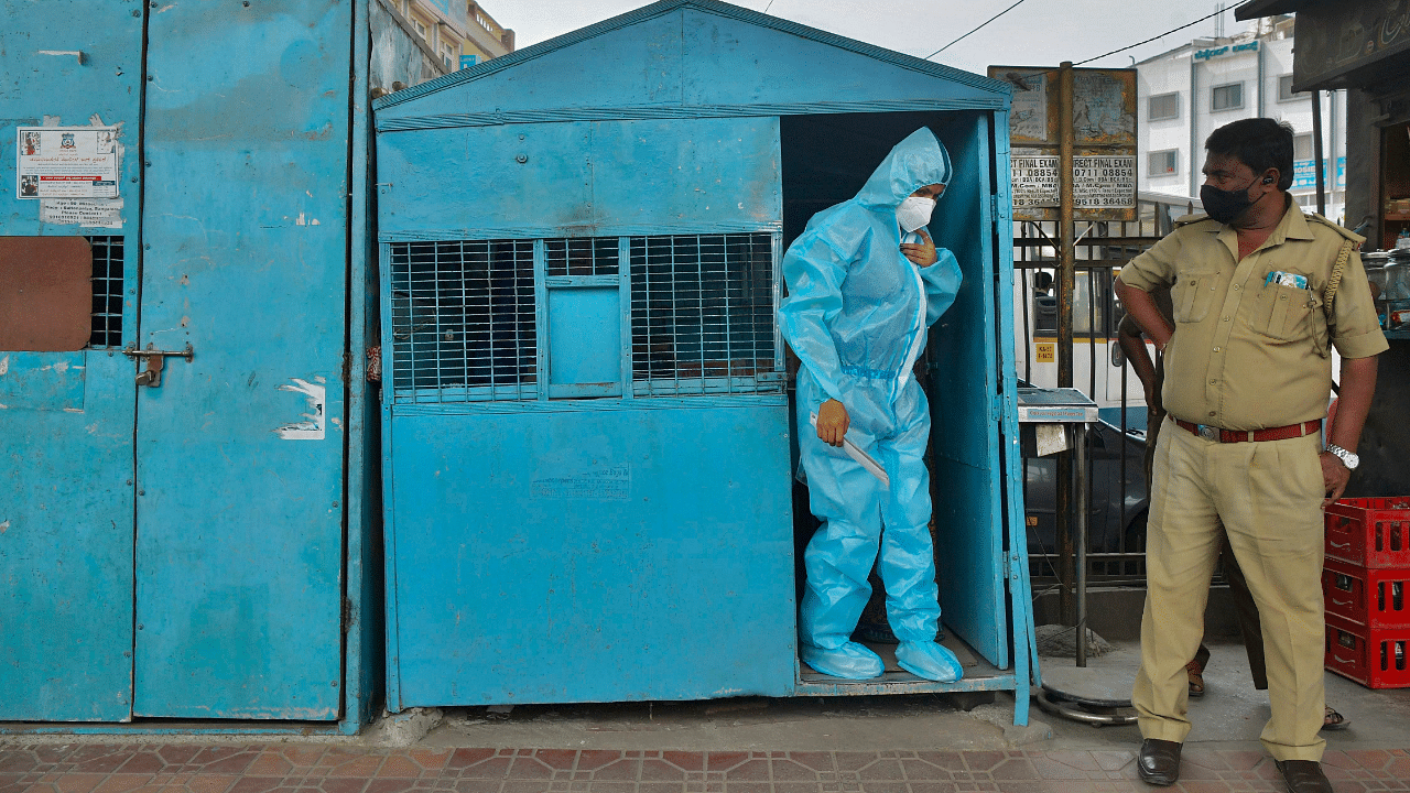  A health worker wearing protective gear prepares to conduct swab tests on people at a mobile Covid-19. Credits: AFP Photo