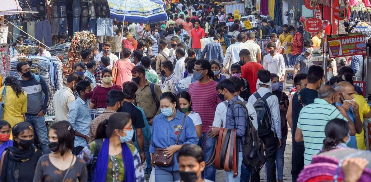 Shoppers visit Sarojini Nagar Market during the festive season, amid the ongoing coronavirus pandemic, in New Delhi. Credit: PTI Photo