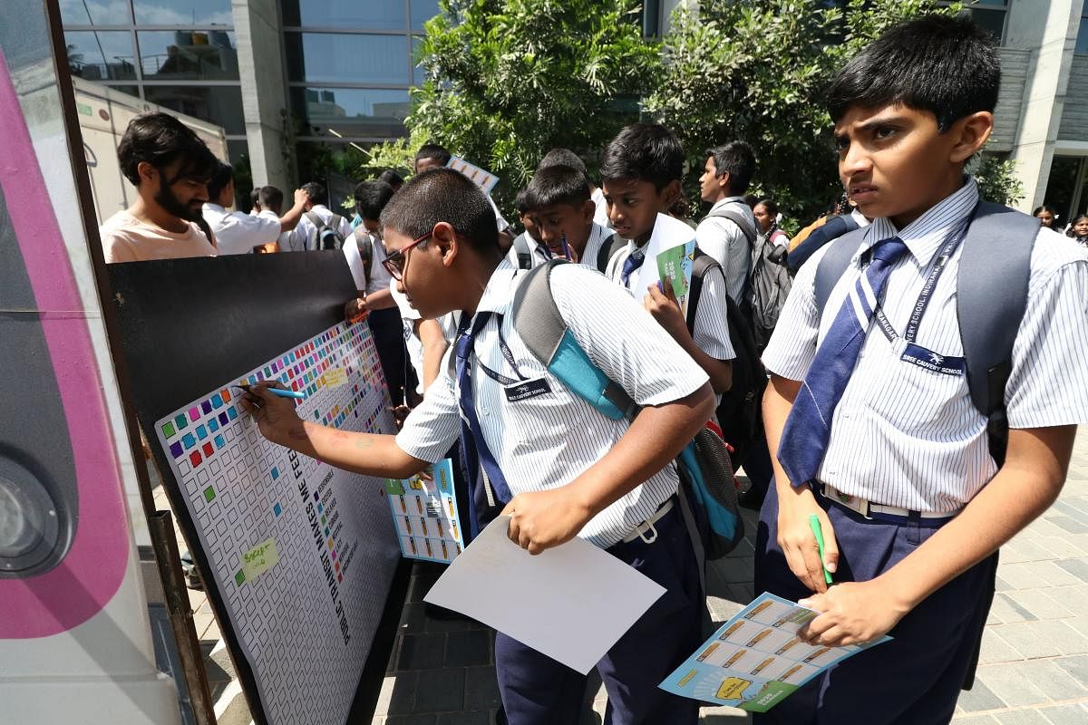 Children offering their suggestions on public transport at a civic fest in the city.