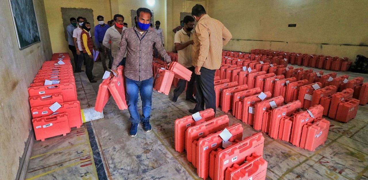 Election officials leave for their respective polling stations after collecting Electronic Voting Machines (EVMs), ahead of the Rajasthan municipal elections. Credit: PTI