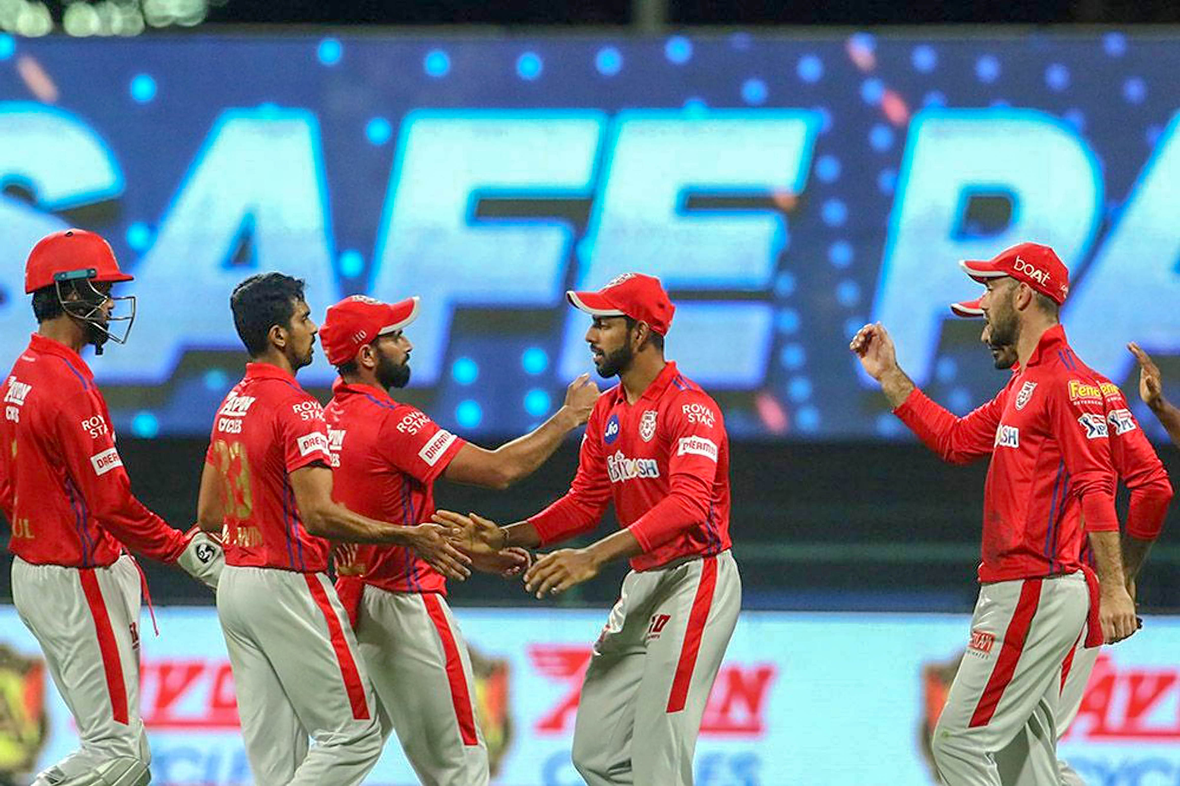 Kings XI Punjab players celebrates the wicket of Robin Uthappa of Rajasthan Royals during the Indian Premier League (IPL) cricket match at the Sheikh Zayed Stadium. Credits: PTI Photo