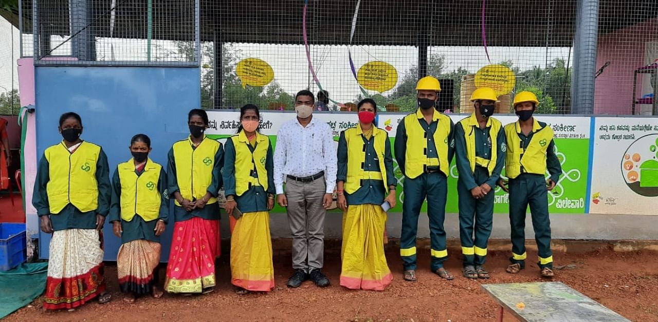 The staff of the waste management unit have uniforms as a part of the branding of the unit at Maravanthe. Credit: DH.