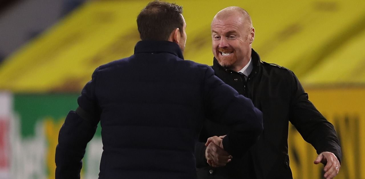 Burnley's English manager Sean Dyche (R) shakes hands with Chelsea's English head coach Frank Lampard (L) at the end of the English Premier League football match between Burnley and Chelsea at Turf Moor in Burnley, north west England. Credit: AFP Photo