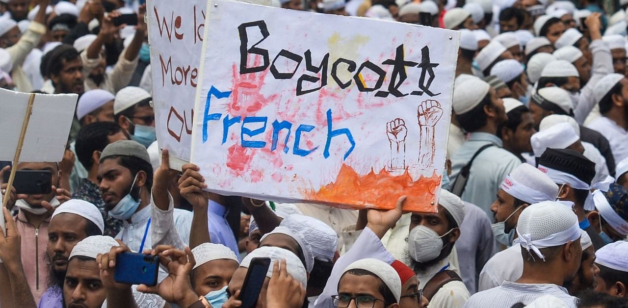 Protesters display placards during an anti-France demonstration in Dhaka on November 2, 2020. Credit: AFP Photo