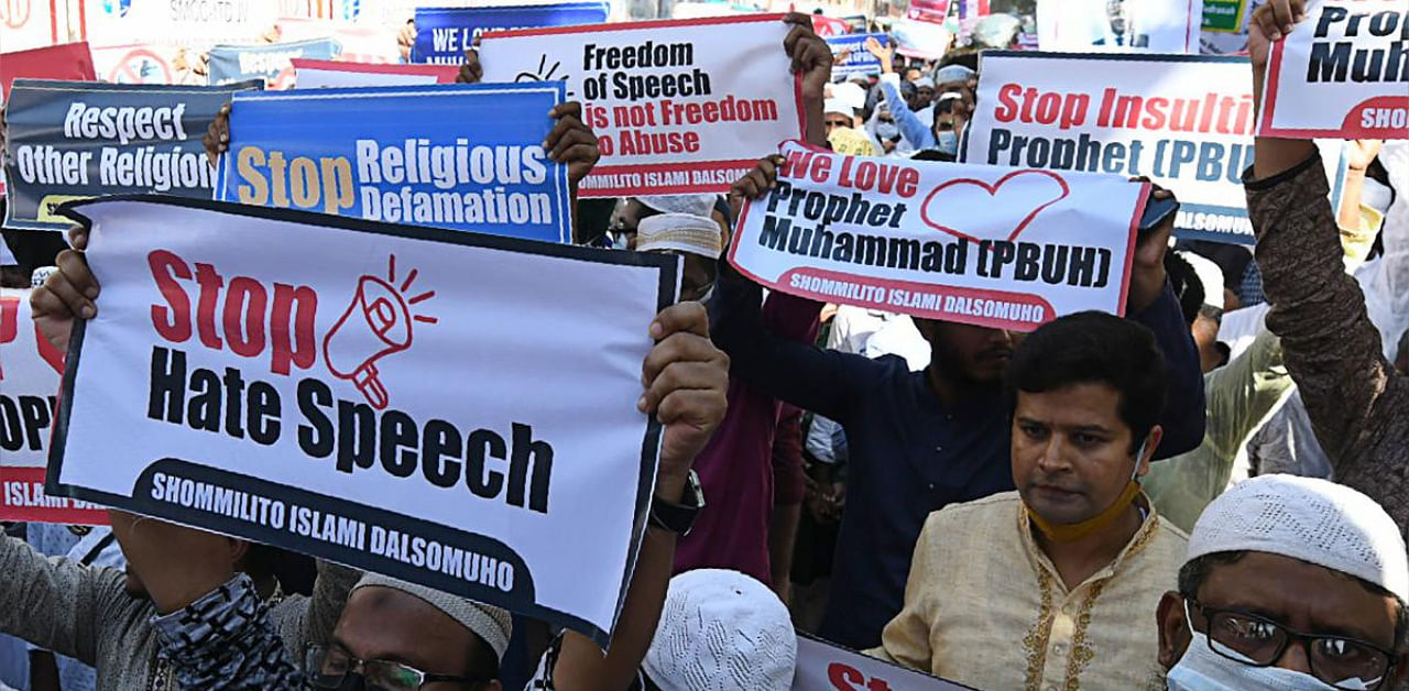 Protesters from an Islamist political party hold banners and shout slogans during a demonstration calling for the boycott of French products and denouncing French President Emmanuel Macron for his comments over Prophet Mohammed caricatures, in Dhaka. Credit: AFP