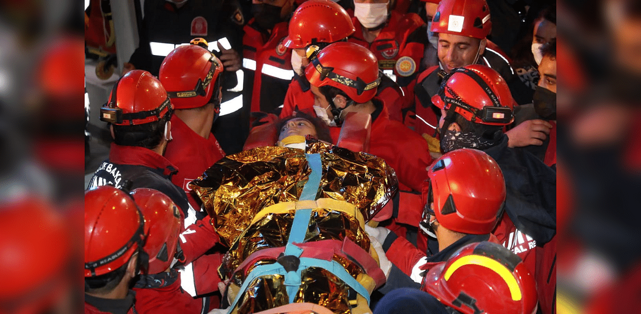 Rescue workers, who were trying to reach survivors in the rubble of a collapsed building, carry 14-year-old Idil Sirin who have been extricated from a collapsed building early Monday, Nov. 2, 2020, 58 hours after a strong earthquake in Izmir, Turkey. Credit: AP 