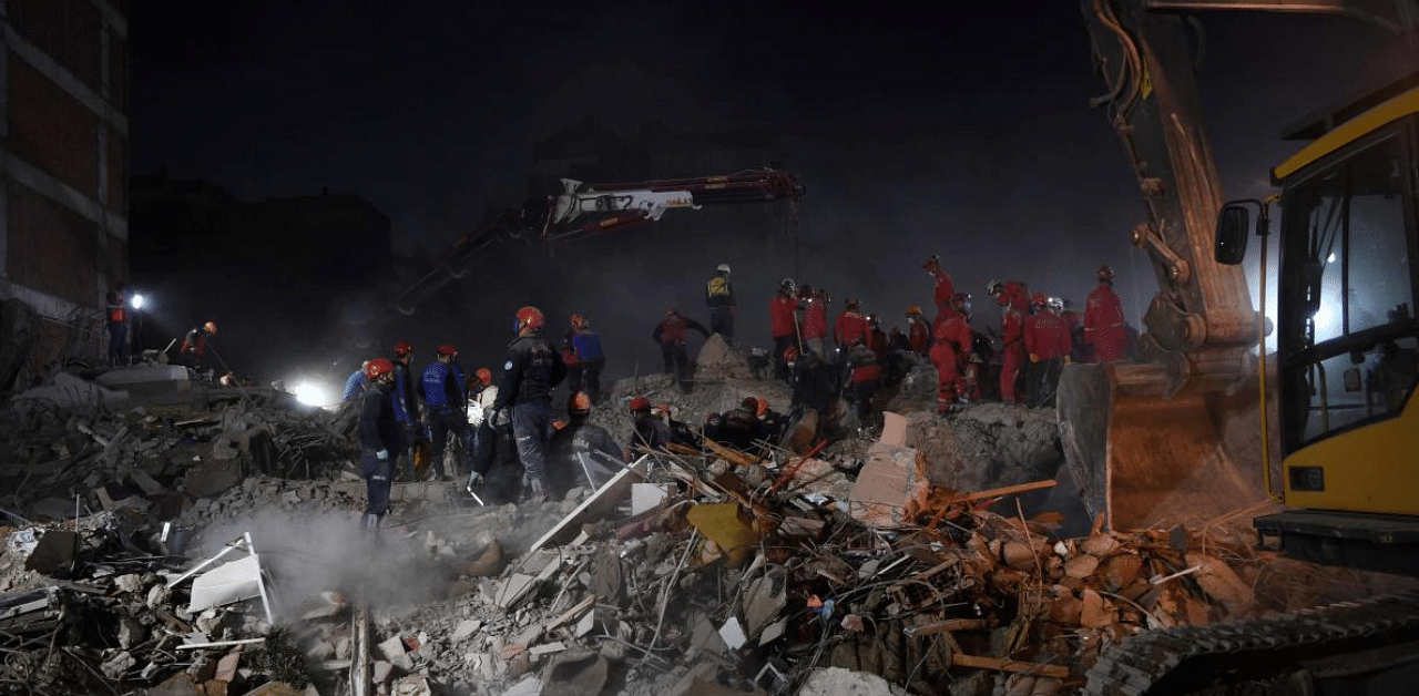 Search and rescue teams look for victims at the site of a collapsed building in Izmir on November 2, 2020, after a powerful earthquake struck Turkey's western coast and parts of Greece two days ago. Credit: AFP Photo
