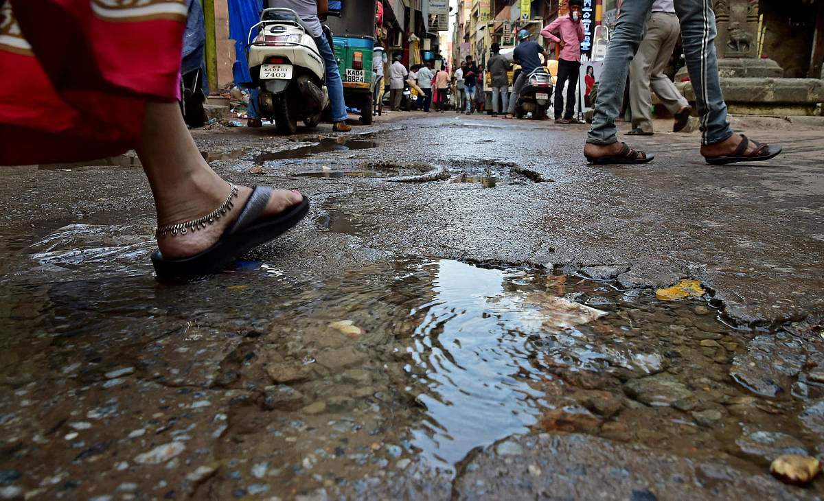 A number of roads in Bengaluru are filled with potholes. The picture is from Avenue Road. DH FILE PHOTO