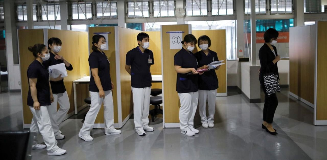 Medical workers at newly-opened Narita International Airport. Credit: Reuters Photo