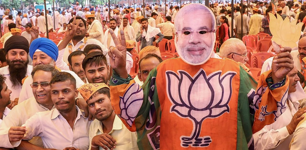 BJP supporters during Uttar Pradesh Chief Minister Yogi Adityanath's rally ahead of Kairana Assembly bypolls. Credit: PTI Photo