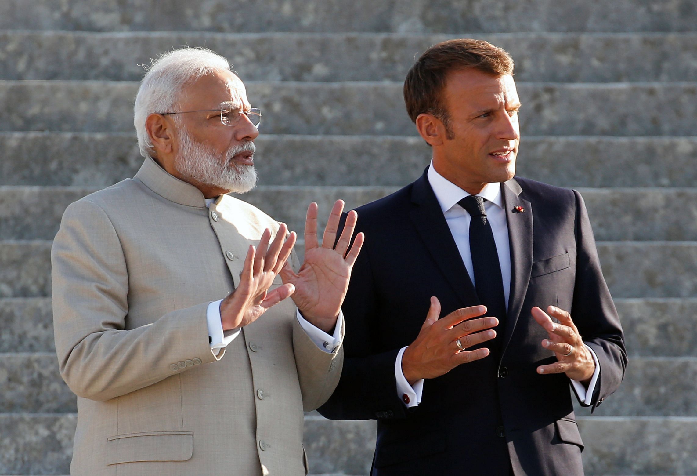 French President Emmanuel Macron (R) and Indian Prime Minister Narendra Modi. Credits: AFP Photo