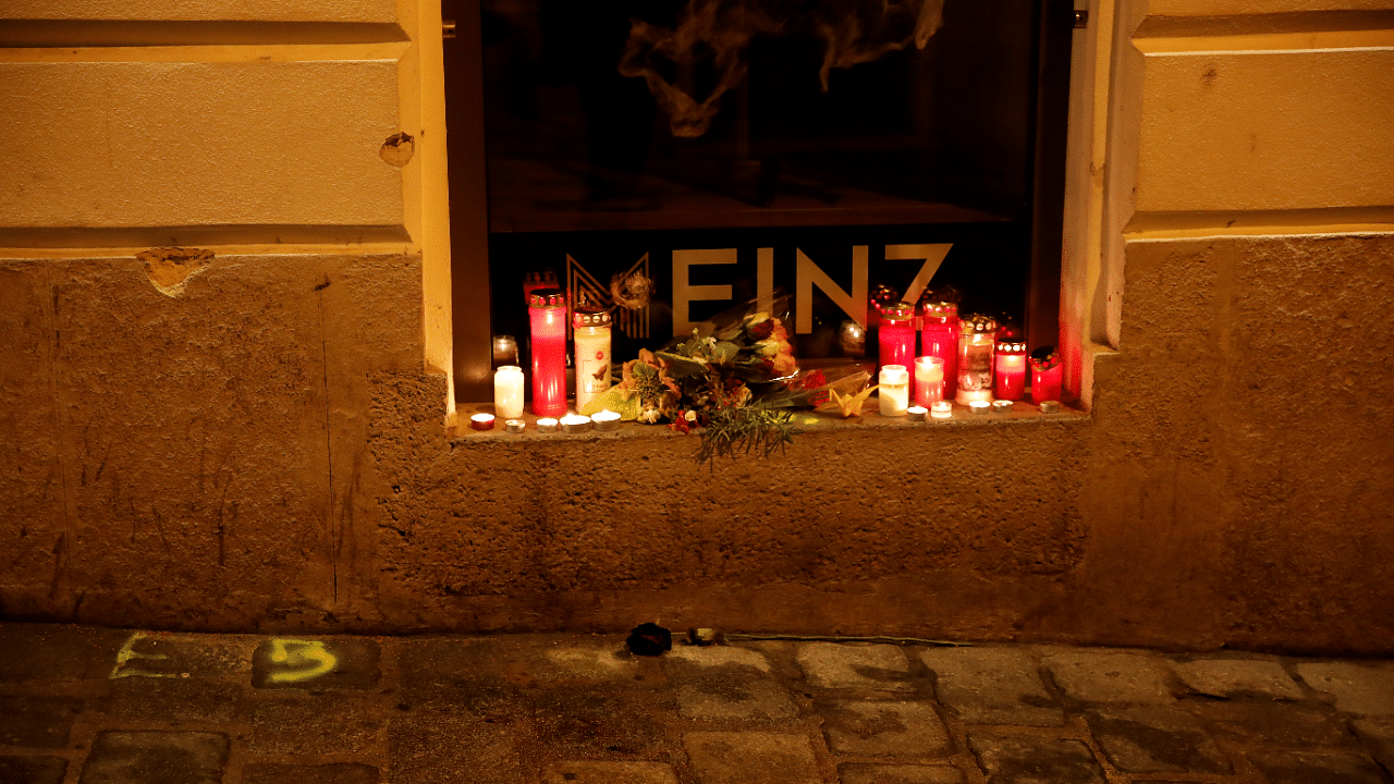 Candles are placed on the site of a gun attack in Vienna, Austria. Credits: Reuters Photo