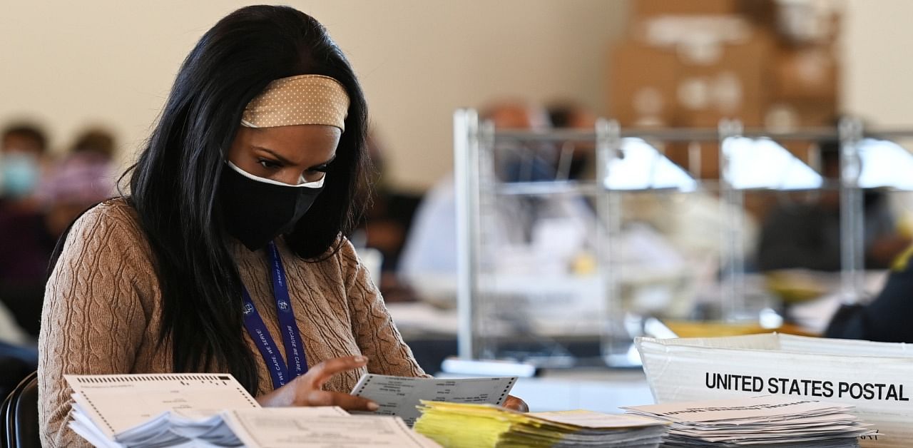 An employee of the Fulton County Board of Registration and Elections processes ballots in Atlanta, Georgia. Credit: Reuters Photo