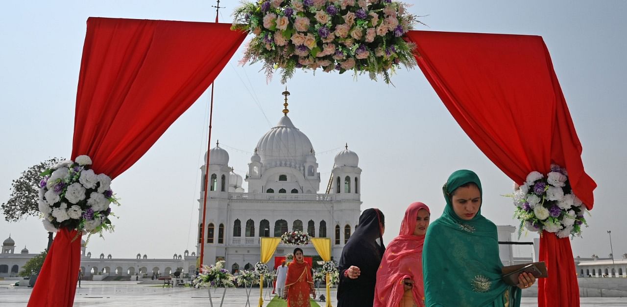 Sikh pilgrims arrive to take part in a religious ritual on the occasion of the 481st death anniversary of Baba Guru Nanak Dev Ji, the founder of Sikhism, at the Gurdwara Darbar Sahib in Kartarpur near the India-Pakistan border. Credit: AFP Photo