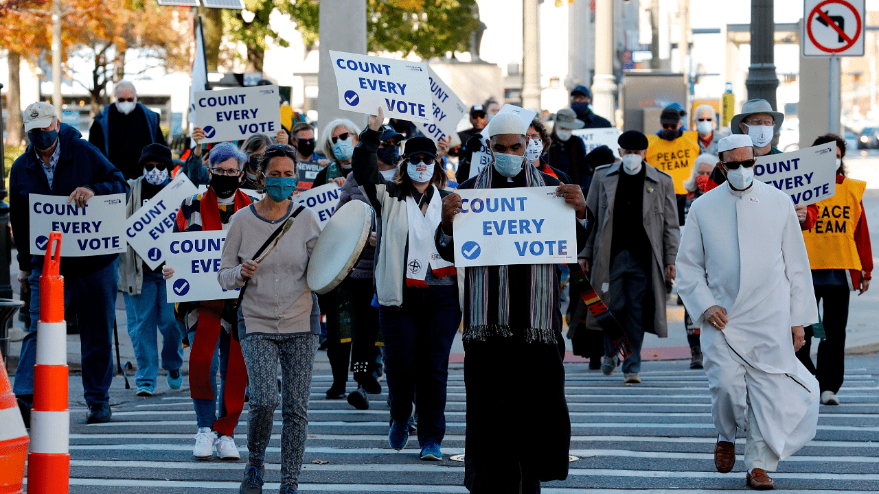 Protestors who want every vote counted from the 2020 presidential election, march down Woodward Avenue. Credits: AFP Photo